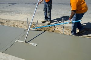 Workers laying concrete for a foundation in Rockwall