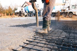 Concrete worker laying a foundation for a business in Rockwall